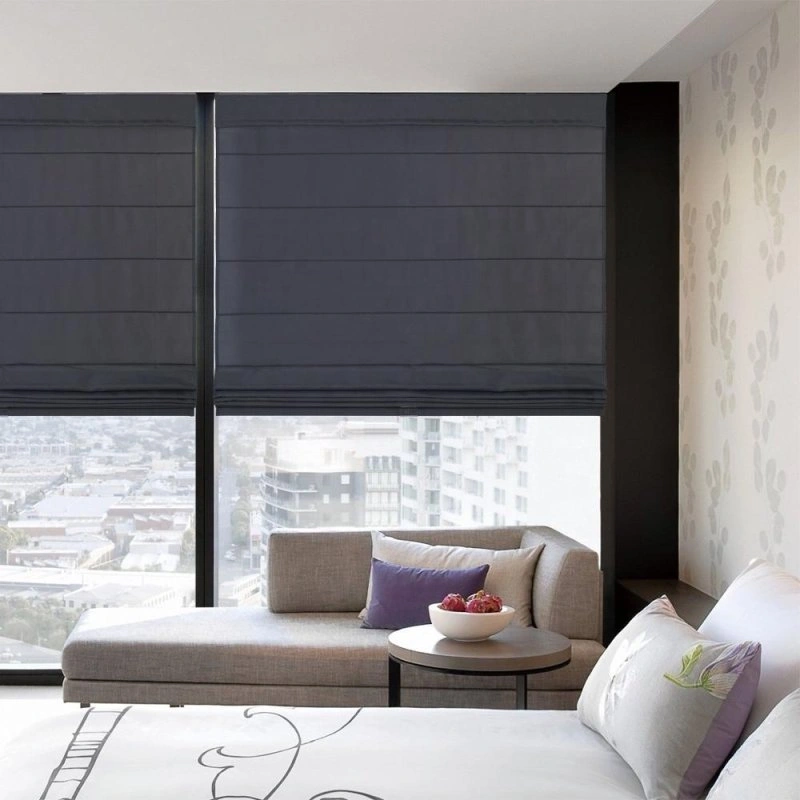 bedroom modern bedroom with a large window covered by dark Roman shades.