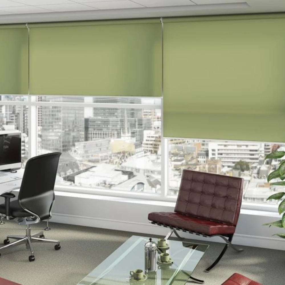 Bright executive office with glass windows, mesh roller blinds, and leather chairs