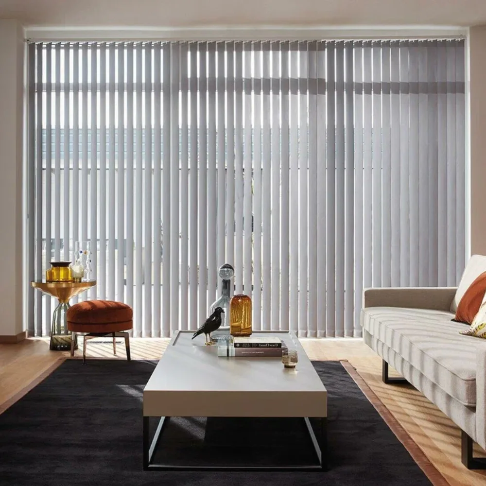 Modern living room with large vertical blinds and contemporary furniture.